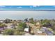 Aerial view showcases the home's proximity to a serene lake, highlighting the waterfront community at 1203 Judy Ave, Tavares, FL 32778