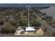 Aerial view of home's location near the water and neighborhood amenities at 1203 Judy Ave, Tavares, FL 32778