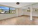 Spacious finished basement with plank flooring, lots of natural light, and a ceiling fan at 1203 Judy Ave, Tavares, FL 32778