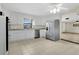 Bright kitchen with stainless steel appliances and white cabinetry and granite countertops at 1203 Judy Ave, Tavares, FL 32778