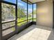 Enjoy this screened lanai with tile floors and view of the lush green backyard and manicured landscape at 126 Maitland Ave # 126, Altamonte Springs, FL 32701