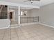 Open-concept living room with stairs to the second floor, view to dining room, and tile flooring at 126 Maitland Ave # 126, Altamonte Springs, FL 32701