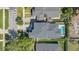 An aerial shot displaying a home with a well-maintained roof and backyard swimming pool at 1312 Vassar St, Orlando, FL 32804
