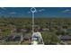 An aerial view showcases a property's location within a neighborhood surrounded by lush greenery and city views at 1312 Vassar St, Orlando, FL 32804
