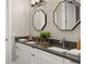Bathroom features a double sink vanity with gray countertops and modern octagon mirrors at 1312 Vassar St, Orlando, FL 32804