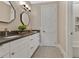 Bathroom featuring dual sink vanity, decorative tile floor, and walk-in shower with decorative niche at 1312 Vassar St, Orlando, FL 32804