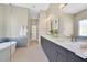 Bathroom view highlighting dual vanities, soaking tub and elegant finishes at 1312 Vassar St, Orlando, FL 32804
