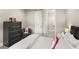 Cozy bedroom featuring a modern dresser and barn door access to the bathroom at 1312 Vassar St, Orlando, FL 32804
