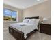 Bedroom features a large window and a dark wood dresser and headboard at 1312 Vassar St, Orlando, FL 32804