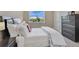 Bright bedroom showcasing a plush bed, large dresser, and a pleasant outdoor view at 1312 Vassar St, Orlando, FL 32804