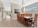 Bright dining room featuring a large wood table, stylish light fixture, and hardwood floors at 1312 Vassar St, Orlando, FL 32804