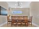 Cozy dining area features a table set for eight, modern lighting, and hardwood floors at 1312 Vassar St, Orlando, FL 32804