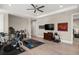 Large home gym featuring workout equipment, hardwood floors, ceiling fan and lots of natural light at 1312 Vassar St, Orlando, FL 32804