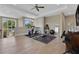 Large workout room with fitness equipment, hardwood floors, ceiling fan and neutral paint at 1312 Vassar St, Orlando, FL 32804