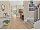Long hallway with an art wall, hardwood flooring, and natural light that leads to other rooms at 1312 Vassar St, Orlando, FL 32804
