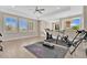 Spacious home gym area with large windows and a variety of exercise equipment at 1312 Vassar St, Orlando, FL 32804
