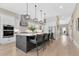 Bright, open kitchen featuring a large island with seating, and stainless steel appliances at 1312 Vassar St, Orlando, FL 32804