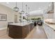 Modern kitchen with a large island with seating, wine cooler, and seamless flow to the living area at 1312 Vassar St, Orlando, FL 32804