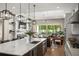Stunning kitchen featuring a large island, quartz countertops, and seamless flow to the living area and backyard at 1312 Vassar St, Orlando, FL 32804