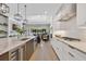Modern kitchen with stainless steel appliances, bright white cabinets and large island with seating at 1312 Vassar St, Orlando, FL 32804