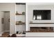 Living room view showcases a modern fireplace, built-in shelves, and a comfortable seating area at 1312 Vassar St, Orlando, FL 32804