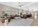 Open-concept living room with modern decor, high ceilings, and seamless access to the kitchen at 1312 Vassar St, Orlando, FL 32804