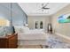 Bright main bedroom with a stylish accent wall, access to the pool, and modern ceiling fan at 1312 Vassar St, Orlando, FL 32804