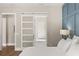Bright main bedroom showing the ensuite bathroom with a stylish sliding door at 1312 Vassar St, Orlando, FL 32804