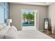 Main bedroom with direct pool access and a stylish modern mirror at 1312 Vassar St, Orlando, FL 32804