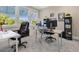 Bright home office with large windows, multiple work stations, and ample storage space at 1312 Vassar St, Orlando, FL 32804