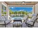 Inviting covered patio with comfortable seating, a ceiling fan, and a view of the backyard pool at 1312 Vassar St, Orlando, FL 32804