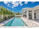 A beautiful backyard pool with surrounding patio, ideal for enjoying sunny days and outdoor gatherings at 1312 Vassar St, Orlando, FL 32804