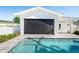 Features a pool with a roll-down screen for added privacy and shade, ensuring a comfortable swimming experience at 1312 Vassar St, Orlando, FL 32804