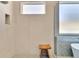Walk-in shower featuring glass enclosure, rainfall shower head, bench and tiled walls at 1312 Vassar St, Orlando, FL 32804