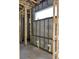 A bathroom during construction, displaying wood framing and concrete block wall at 1402 Stetson St, Orlando, FL 32804