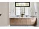 Elegant bathroom with double sinks, a marble countertop, modern fixtures, and plenty of storage space at 1402 Stetson St, Orlando, FL 32804