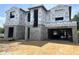 Two story home's exterior showing Tyvek HomeWrap and concrete block construction against a sunny sky at 1402 Stetson St, Orlando, FL 32804