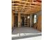 Interior view showcases lumber framing and concrete block construction during the home building process at 1402 Stetson St, Orlando, FL 32804