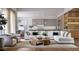 Bright, open-concept living room showcasing modern decor, a comfortable sofa, and a view of the adjacent kitchen and dining area at 1402 Stetson St, Orlando, FL 32804