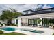 Outdoor space featuring a luxurious pool, hot tub, covered dining area, and a built-in outdoor kitchen, perfect for entertaining at 1402 Stetson St, Orlando, FL 32804