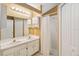 Well-lit bathroom featuring double sinks, ample counter space, and a shower with curtain at 14026 Eckard Ct, Orlando, FL 32826