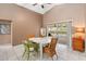 Dining room with vaulted ceilings, tile floor, and sliding door to screened lanai at 14026 Eckard Ct, Orlando, FL 32826