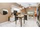 Open kitchen with white cabinets, a kitchen island, and updated appliances at 14026 Eckard Ct, Orlando, FL 32826