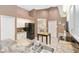 Well-lit kitchen featuring white cabinets, stainless appliances, and a tile floor at 14026 Eckard Ct, Orlando, FL 32826