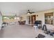 Spacious screened lanai features ceiling fans, multiple seating areas, and access to the home's interior at 14026 Eckard Ct, Orlando, FL 32826