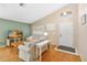 Bright living room featuring hardwood floors, vaulted ceilings, and ample natural light at 14026 Eckard Ct, Orlando, FL 32826