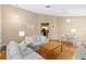 Comfortable living room with hardwood floors, neutral paint, and plenty of seating at 14026 Eckard Ct, Orlando, FL 32826
