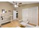 Functional home office with closet, vaulted ceiling, wood floors and comfortable seating at 14026 Eckard Ct, Orlando, FL 32826