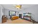 Bedroom with a large window, a fish tank, and neutral walls at 141 Greenfield Rd, Winter Haven, FL 33884