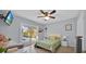 Bedroom with a ceiling fan, a sliding door with a view of the backyard, and neutral wall color at 141 Greenfield Rd, Winter Haven, FL 33884